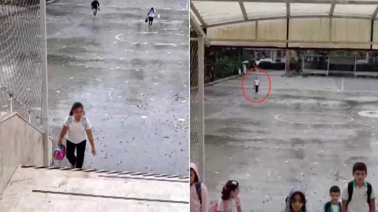 Küçük Asel'den dikkat çeken davranış: Yağmur altında İstiklal Marşı'na eşlik etti